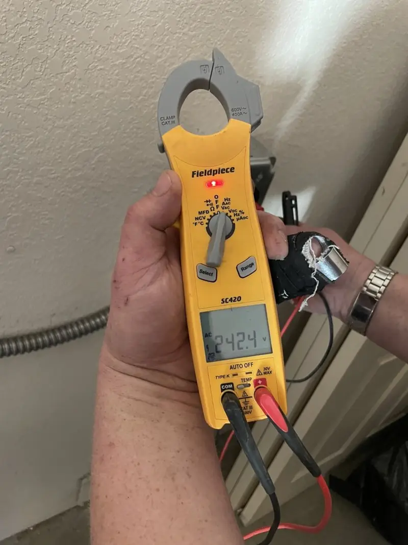 Voltage testing with clamp meter during Ceiling Fan Installation in Leacock